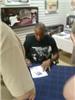 Calvin signing on Sportscollectors.Net